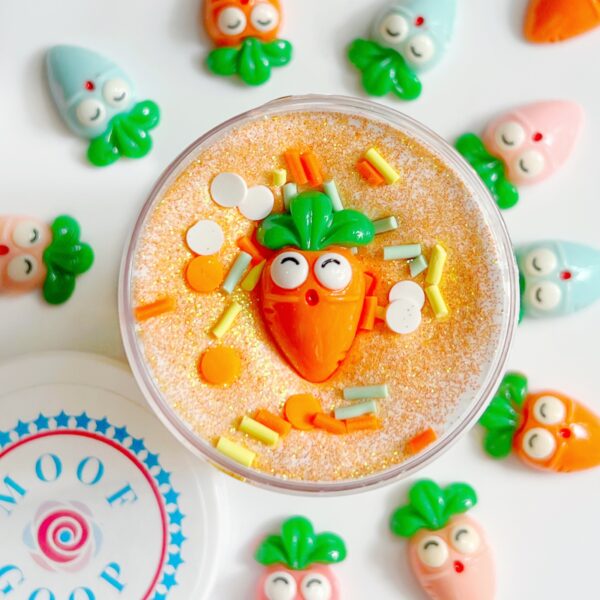 This Carrot Cake slime beautifully replicates the spicy and sweet cake we all love. This slime has two layers. One is a super crunchy snow fizz ‘cake’ slime, and a soft cream cheese frosting layer. It then is topped with orange glitter, a customized sprinkle mix, and comes with a carrot charm! Enjoy!